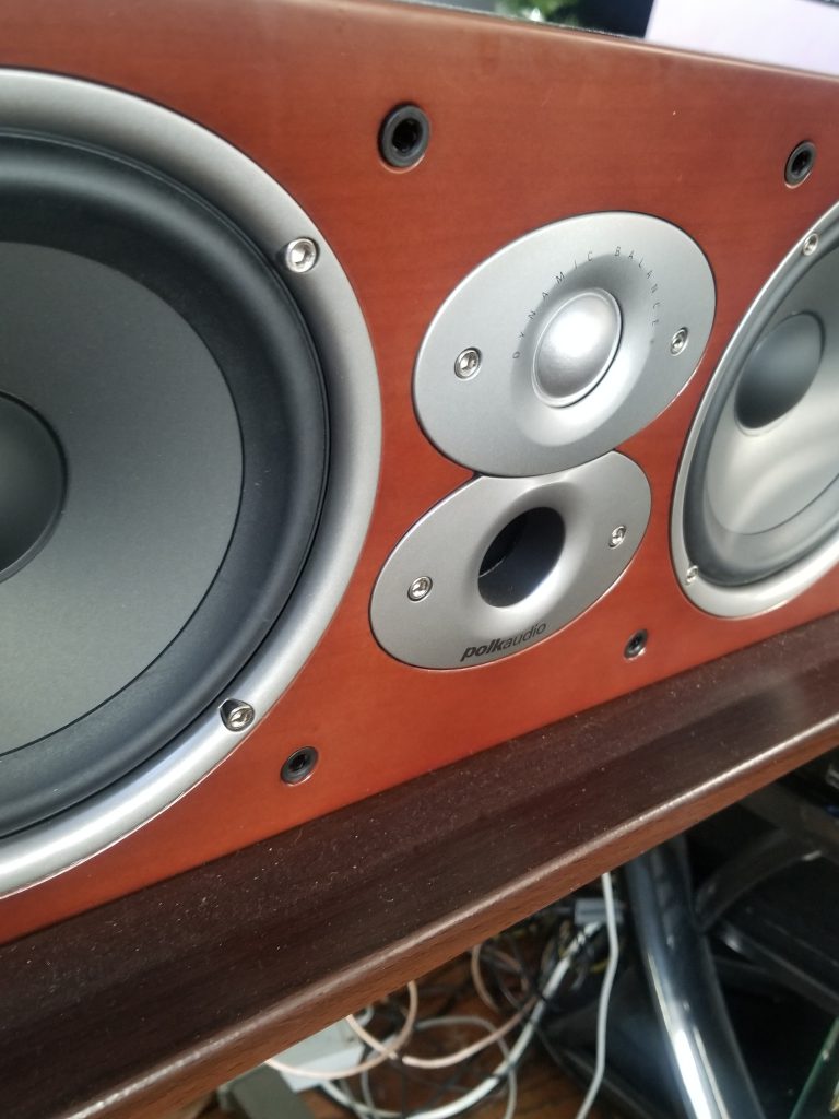 The speaker being shown is the featured one in my Polk RTI A6 Review. In this picture, it's sitting on a table in cherry red.