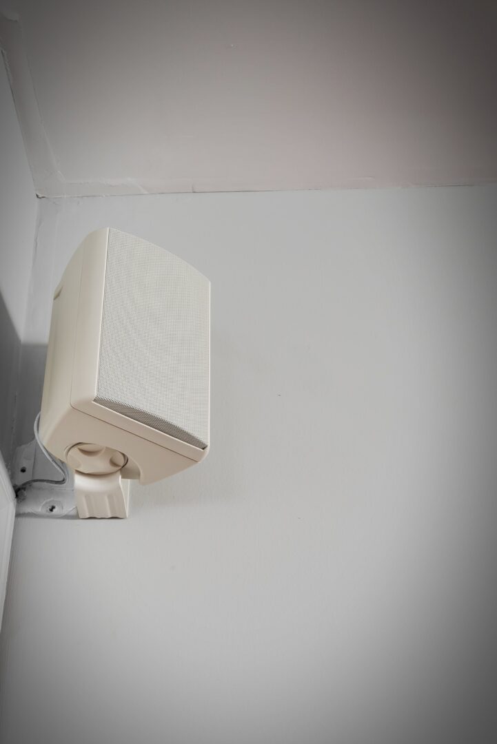 A picture of a white outdoor speaker