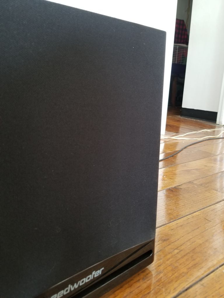 A closeup of a subwoofer