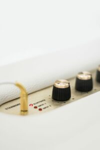 A picture of analog knobs on an amplifier